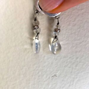 A pair of moon drop and sterling silver earrings.